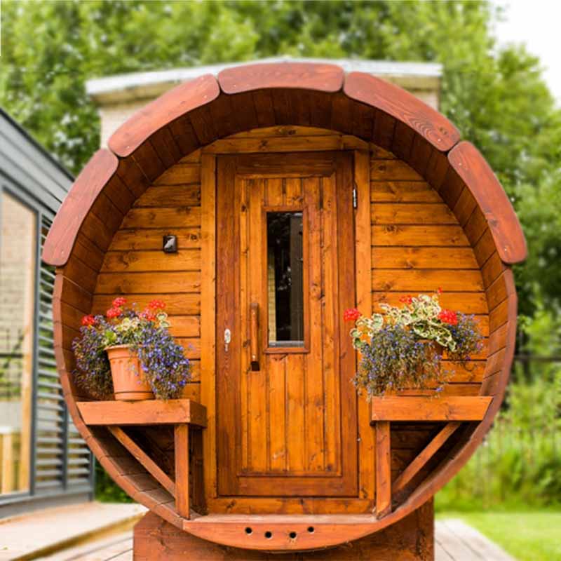 Viking Industrier Traditional Barrel Sauna 1900x2500mm front view with flower planters and wooden steps in garden setting.