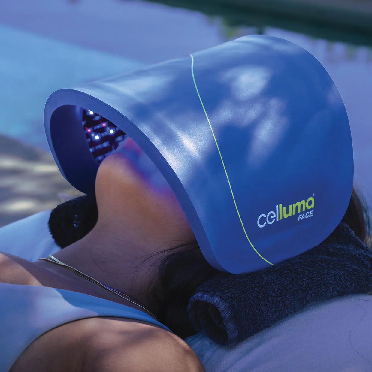Person using a Celluma Light Therapy Face Mask for skin treatment outdoors