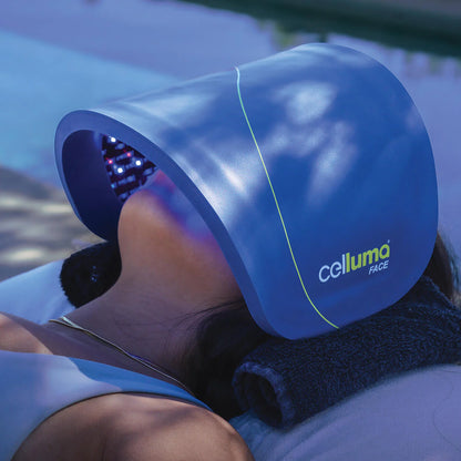 Person using a Celluma Light Therapy Face Mask for skin treatment outdoors