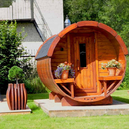 Viking Industrier Traditional Barrel Sauna placed in green garden landscape, ideal for outdoor wellness spaces.