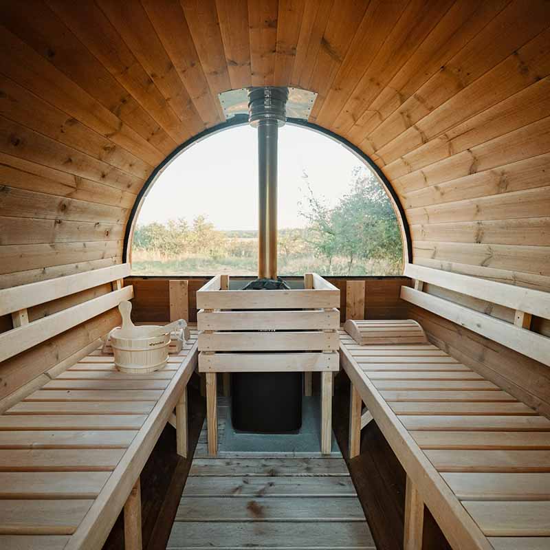 Interior of Viking Industrier Barrel Sauna 1900x2500mm with panoramic window, benches and natural wood finish.