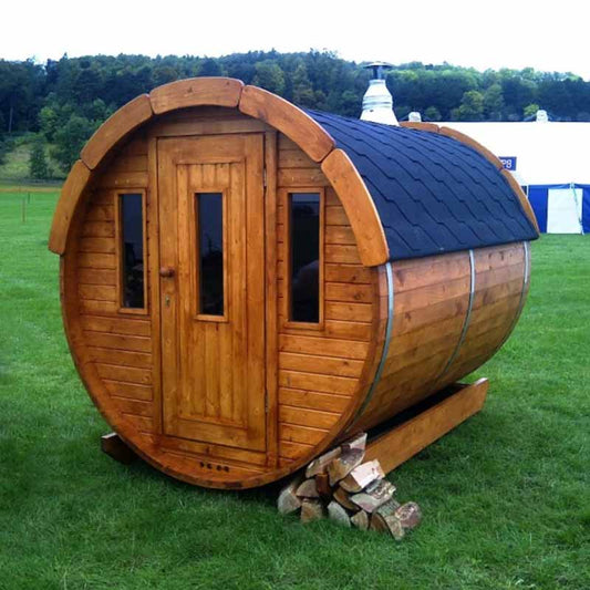 Viking Industrier Traditional Barrel Sauna placed in green garden landscape, ideal for outdoor wellness spaces.